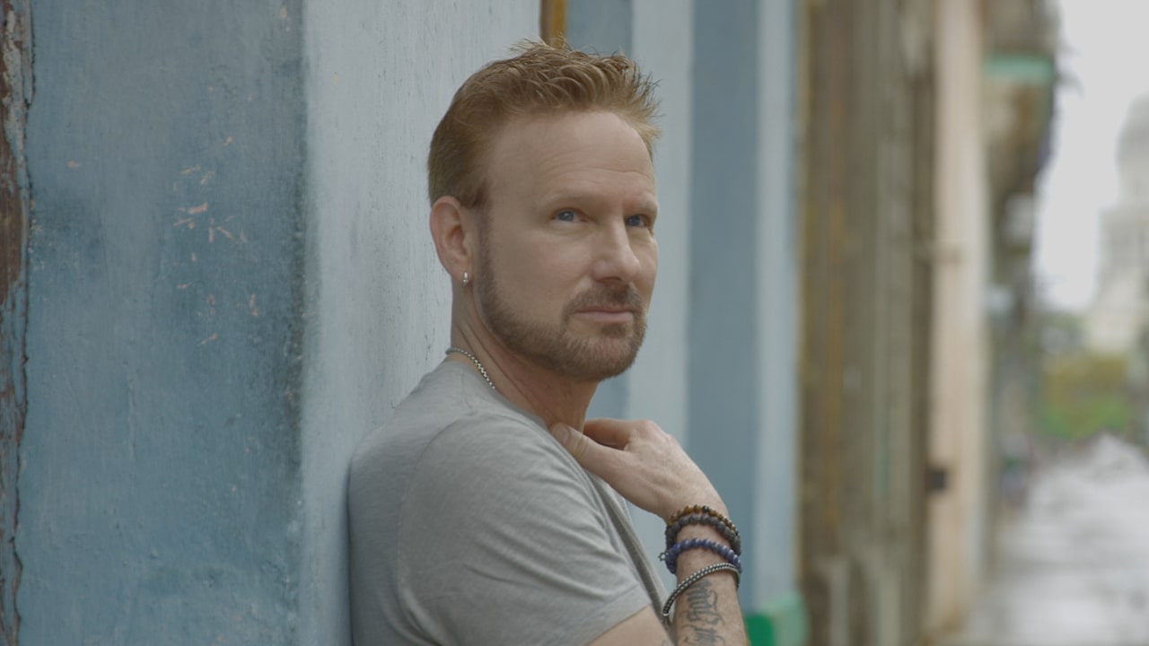 A man leaning against a wall